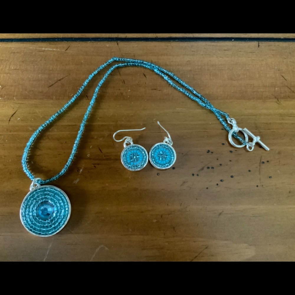 Beaded necklace and earring set with silver accents.